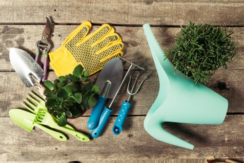 Professional gardeners maintaining a small garden in Charing Cross