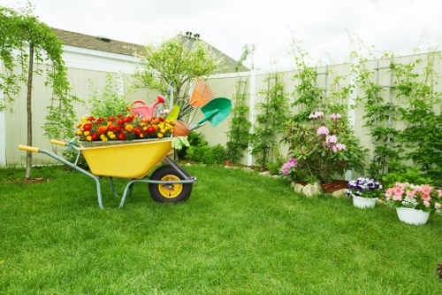 Gardeners in Charing Cross working on a well-kept urban garden