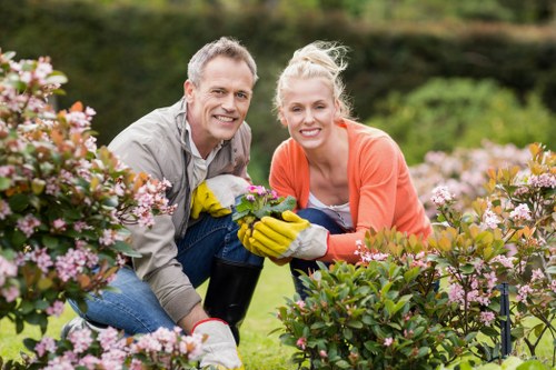 Local gardeners shaping a balanced and healthy garden space in Charing Cross